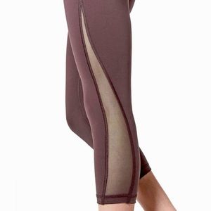 lululemon Train Times crop 21” running tight with mesh leg panels.